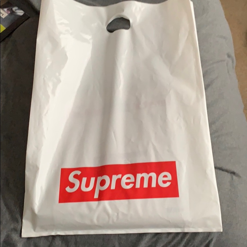 supreme bag and newspaper